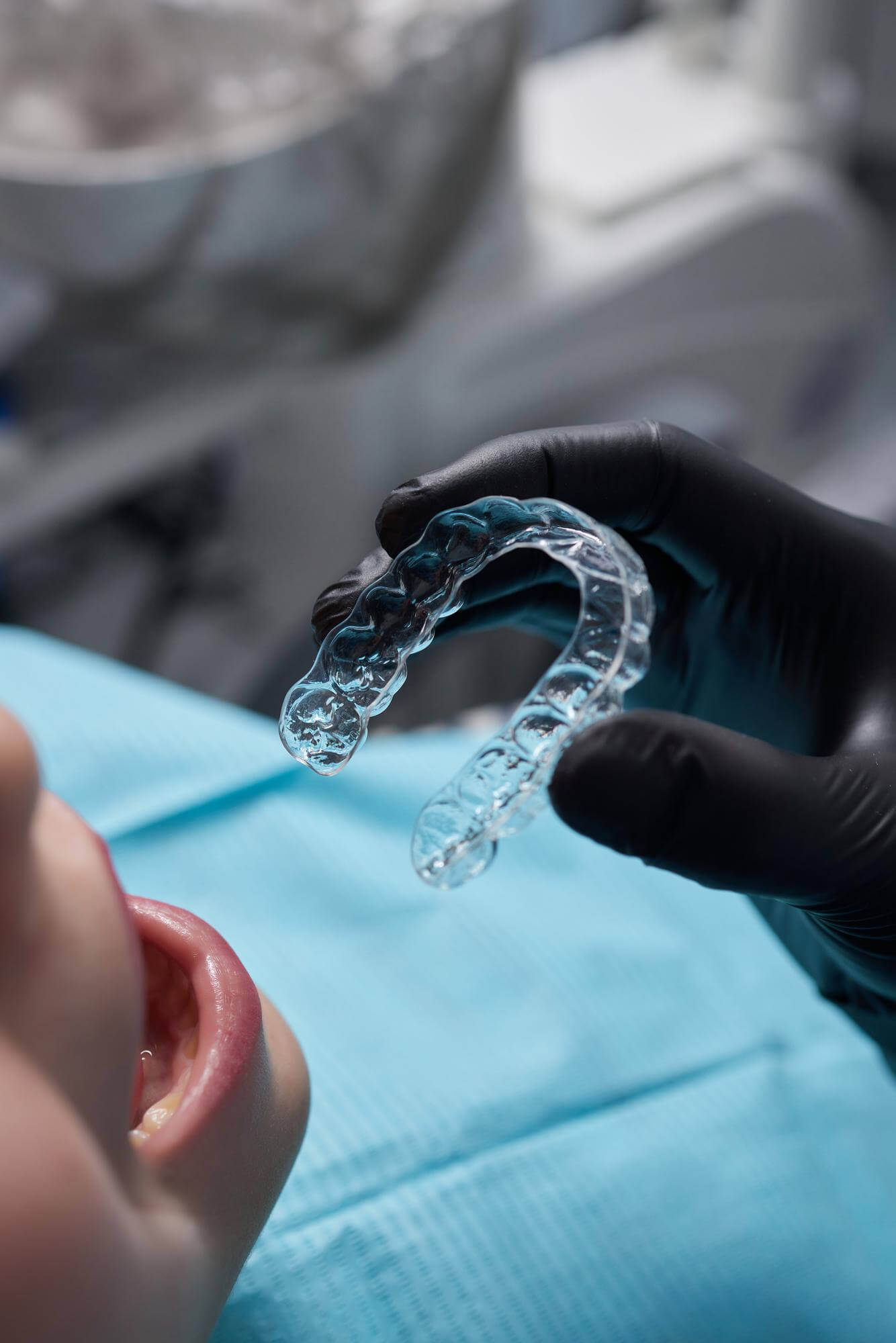 caucasian-little-kid-girl-invisible-aligner-pointing-her-perfect-straight-teeth-dental-healthcare-confidence-concept (1)