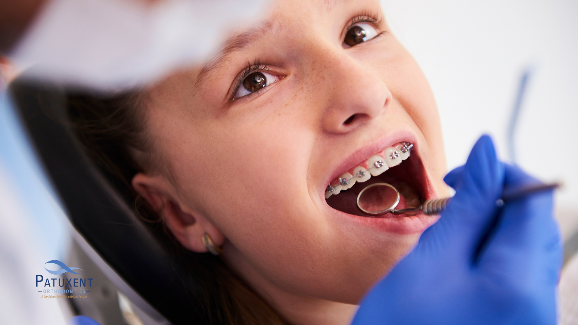 Orthodontist checking braces