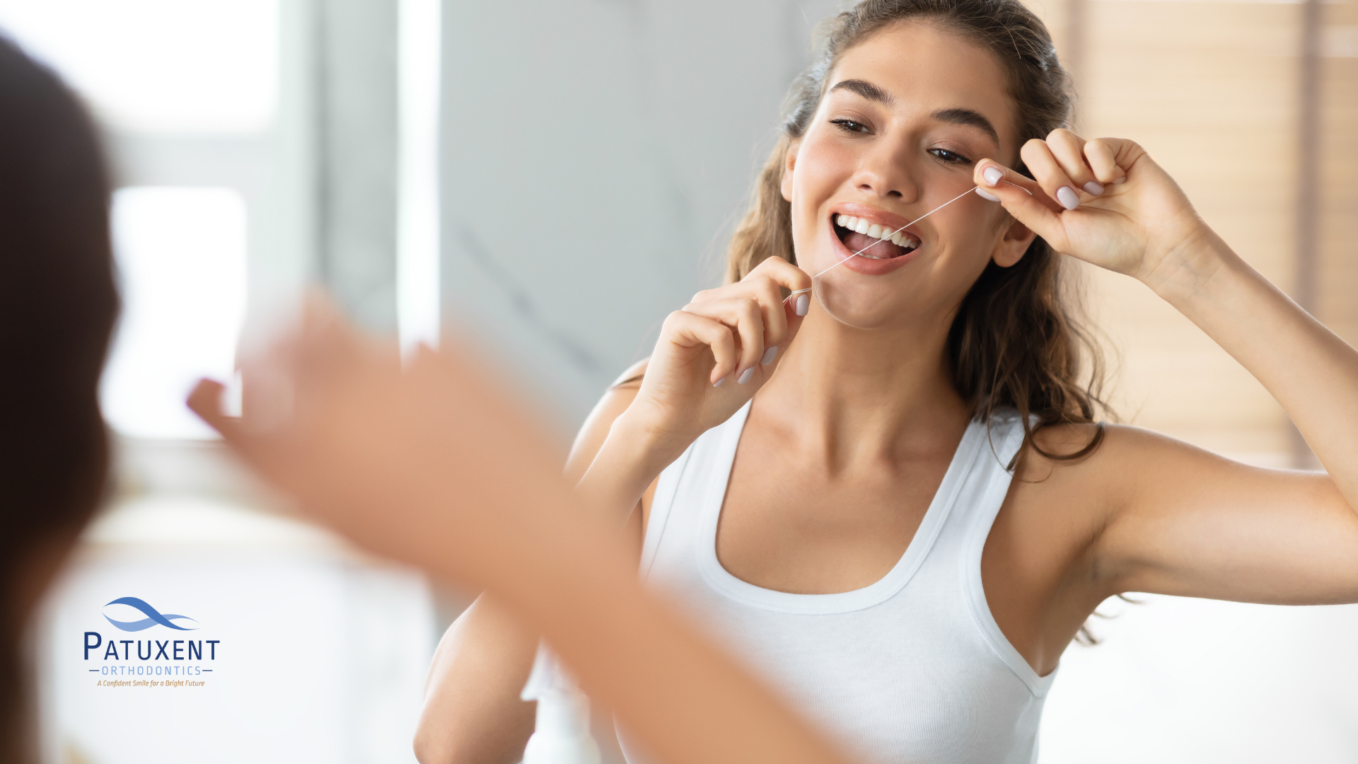 Woman flossing with thread