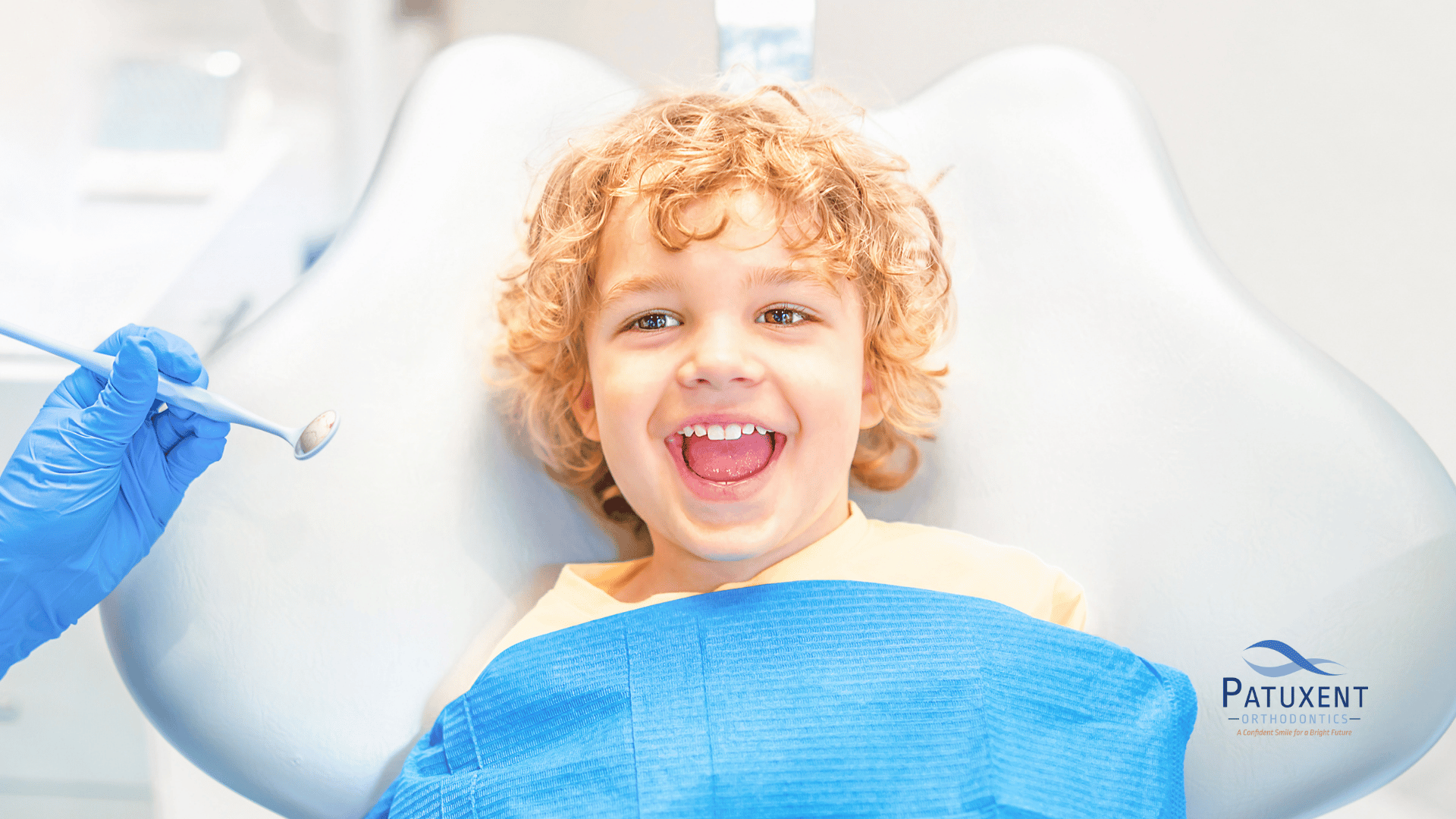 A child smiling during orthodontic appointment
