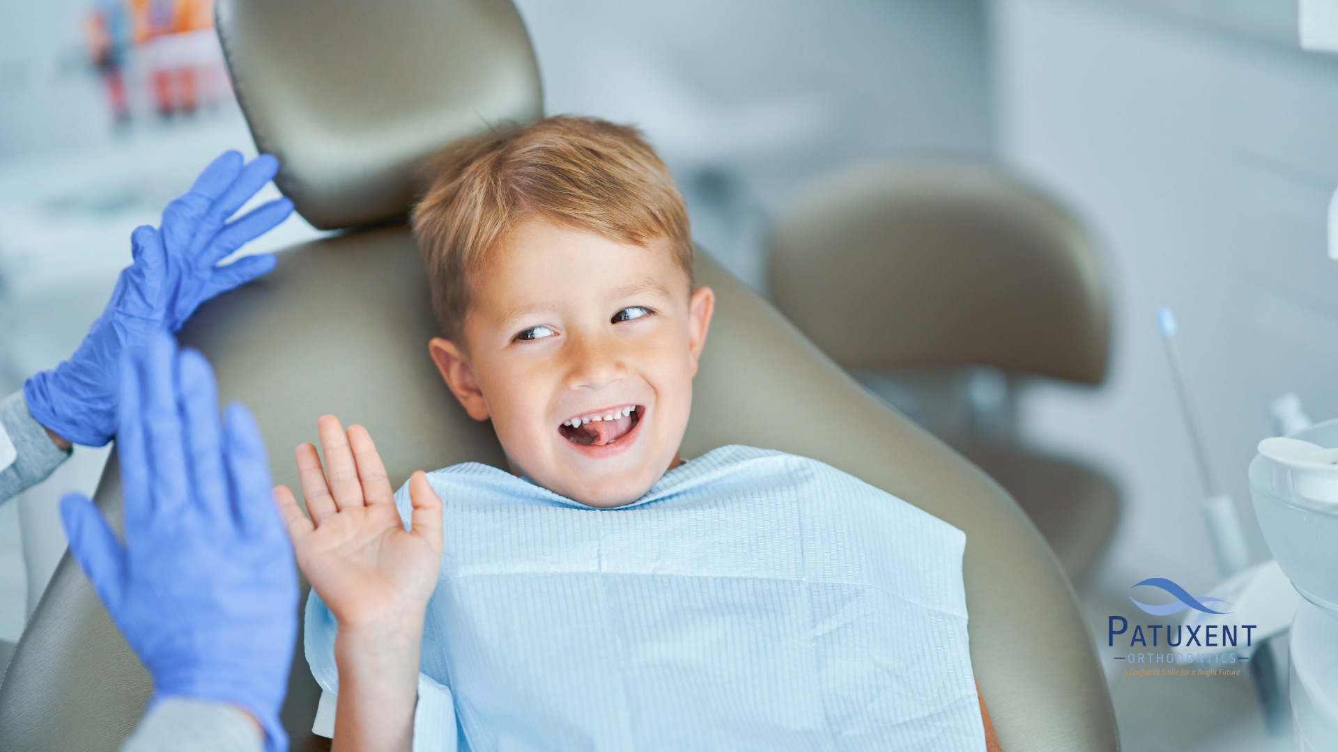 This is an image of a young boy during an orthodontic appointment